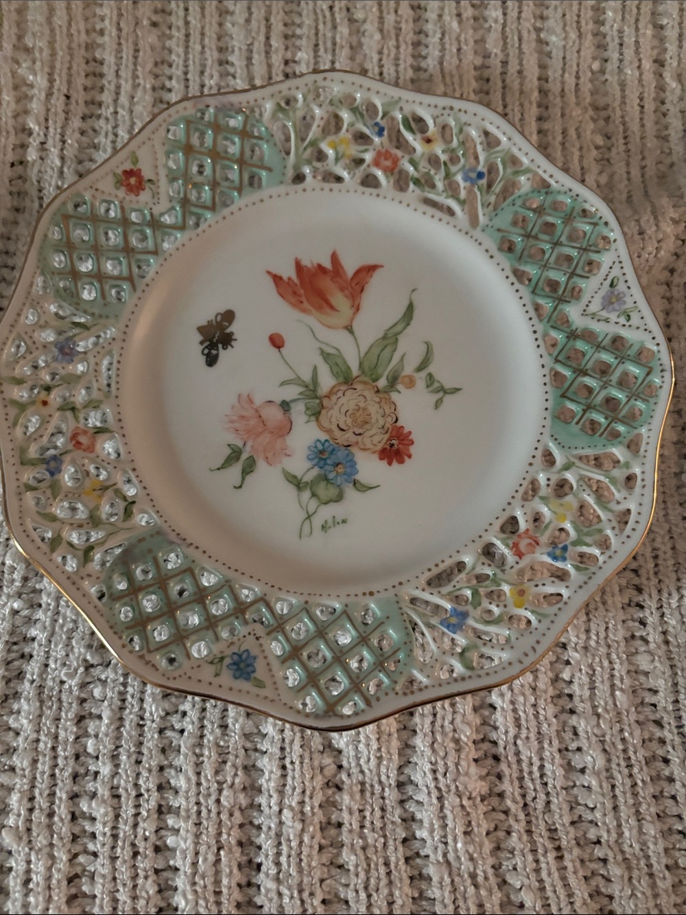Porcelain reticulated plate with hand-painted floral design by Dresden